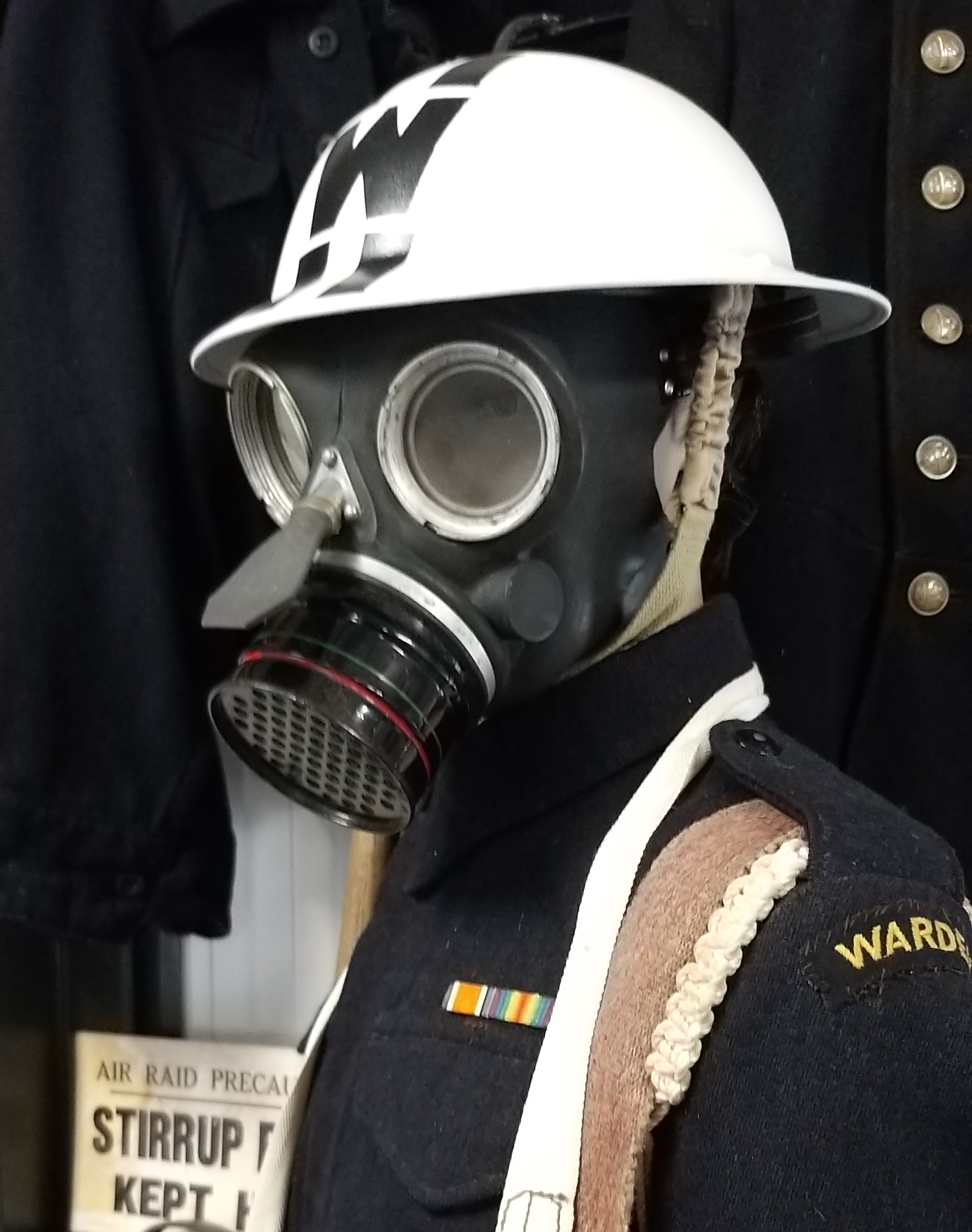A picture of a Air Warden with a gasmask on