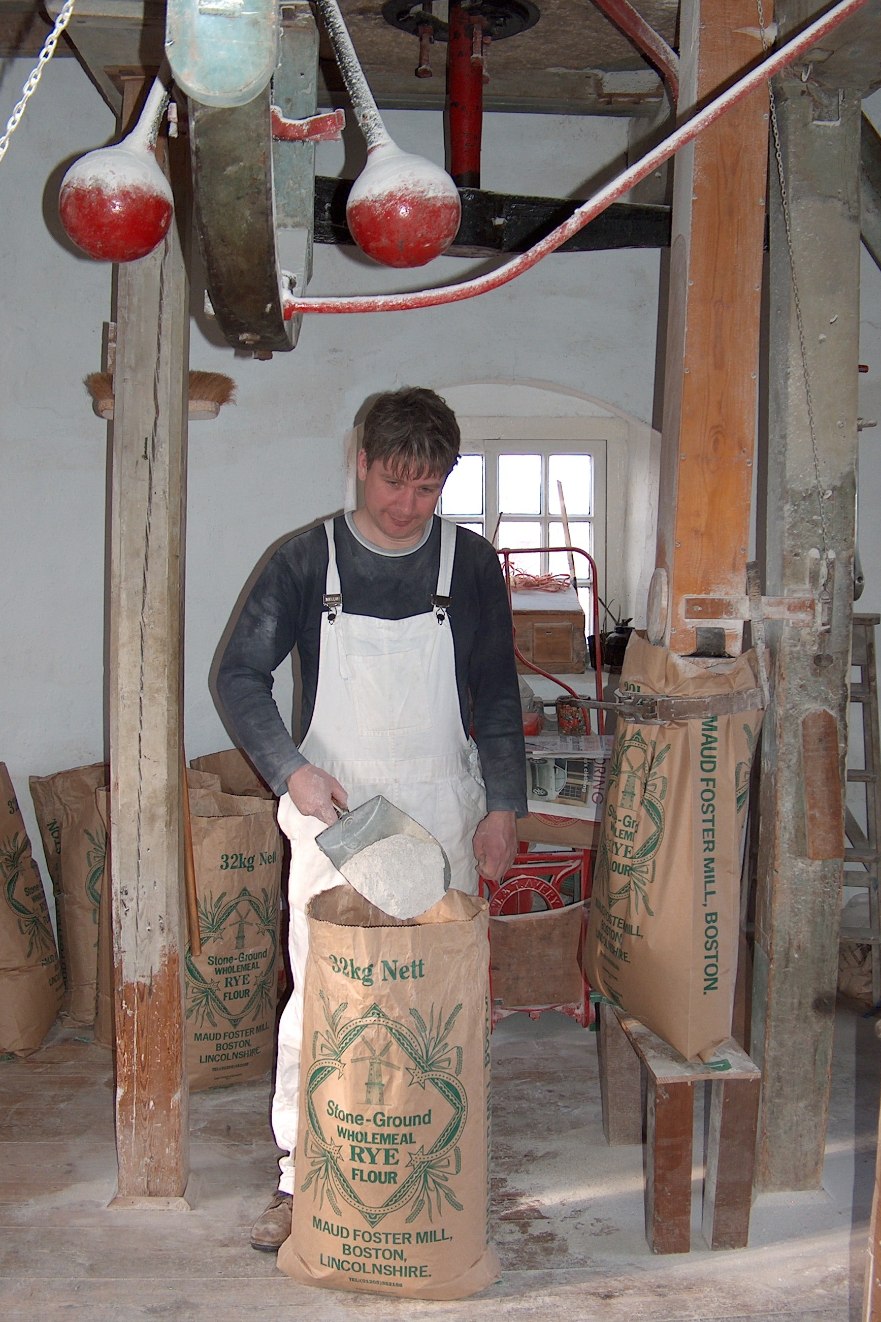 Flour being produced and collected in sacks